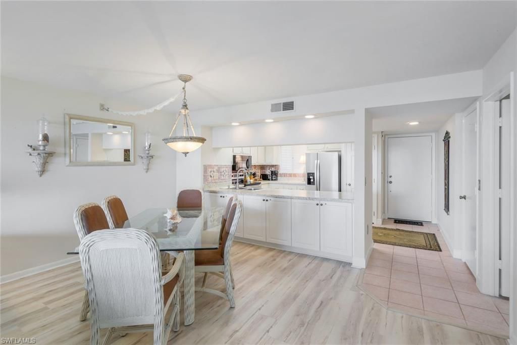 Dining room, Interior, Kitchen, Pendant Lights, Recessed Lighting, Stainless Steel Appliances, Wood Texture Flooring