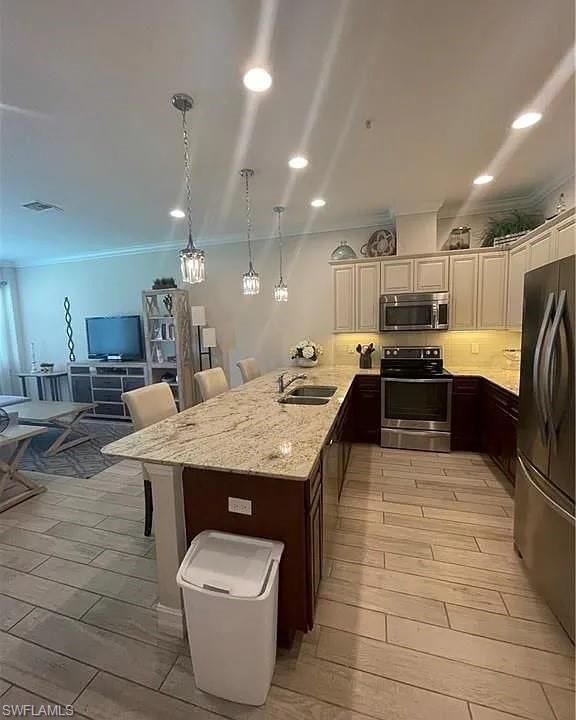 Dining room, Interior, Kitchen, Pendant Lights, Recessed Lighting, Stainless Steel Appliances, Wood Texture Flooring