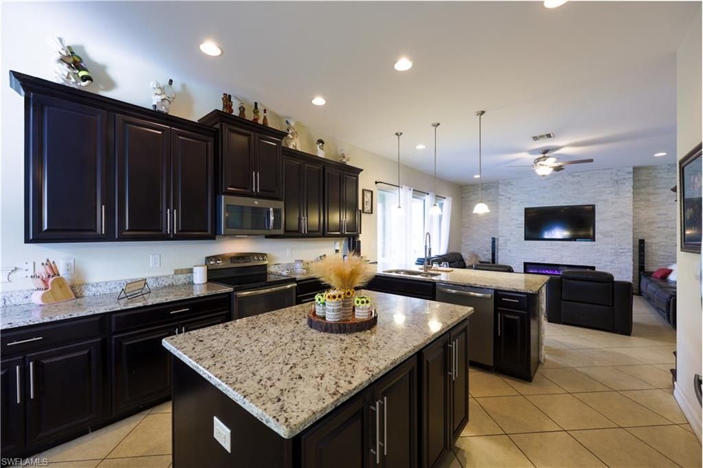 Interior, Kitchen, Living room, Pendant Lights, Recessed Lighting, Stainless Steel Appliances, Stone Walls