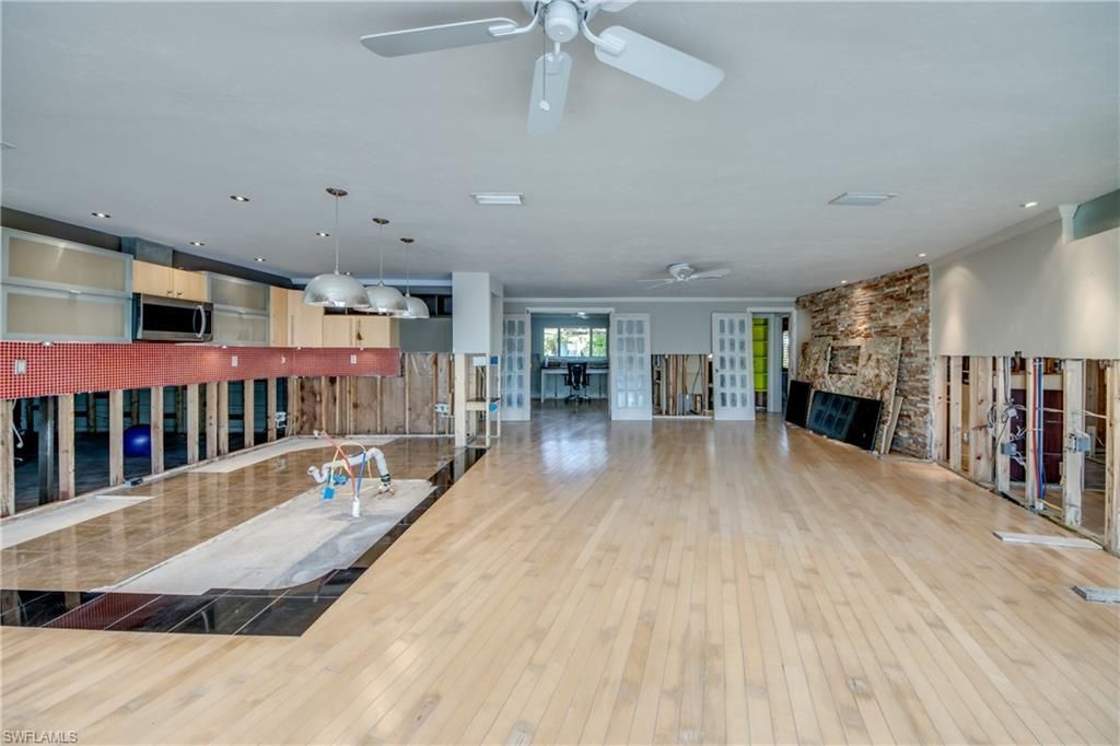 Fireplace, Interior, Kitchen, Pendant Lights, Recessed Lighting, Stone Walls, Wood Texture Flooring