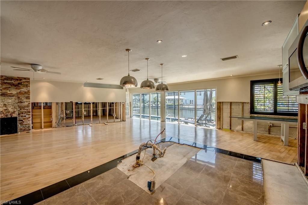 Fireplace, Interior, Pendant Lights, Recessed Lighting, Stone Walls, Wood Texture Flooring