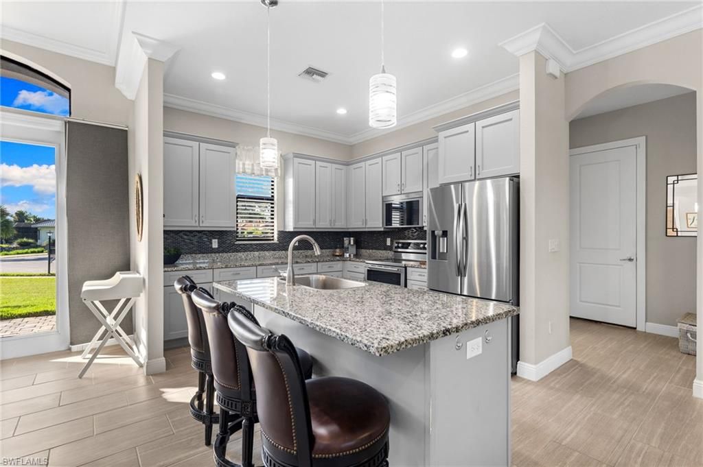 Interior, Kitchen, Pendant Lights, Recessed Lighting, Stainless Steel Appliances, Wood Texture Flooring