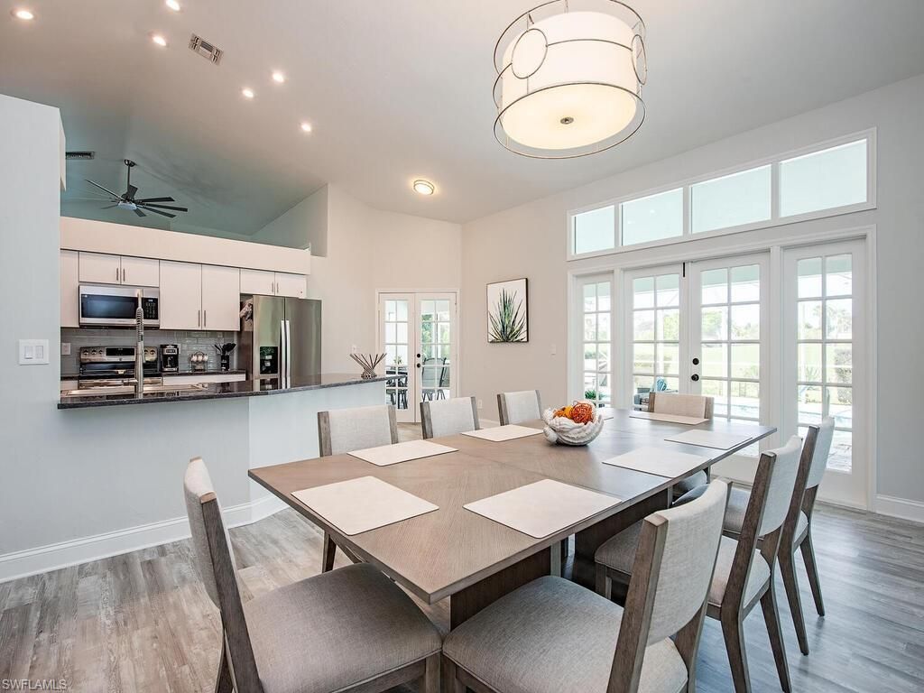 Dining room, Interior, Kitchen, Recessed Lighting, Stainless Steel Appliances, Wood Texture Flooring