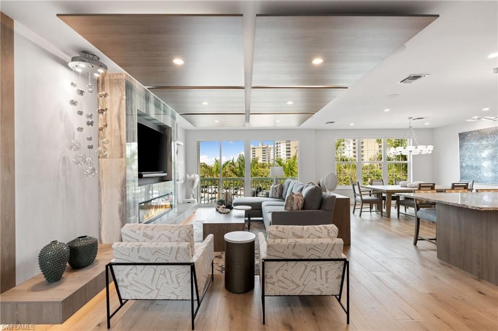 Dining room, Fireplace, Interior, Living room, Pendant Lights, Recessed Lighting, Wood Texture Flooring
