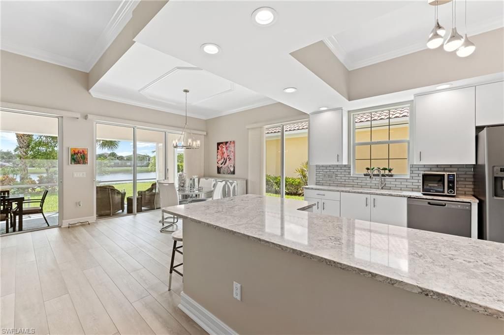 Chandelier, Dining room, Interior, Kitchen, Pendant Lights, Recessed Lighting, Water, Wood Texture Flooring