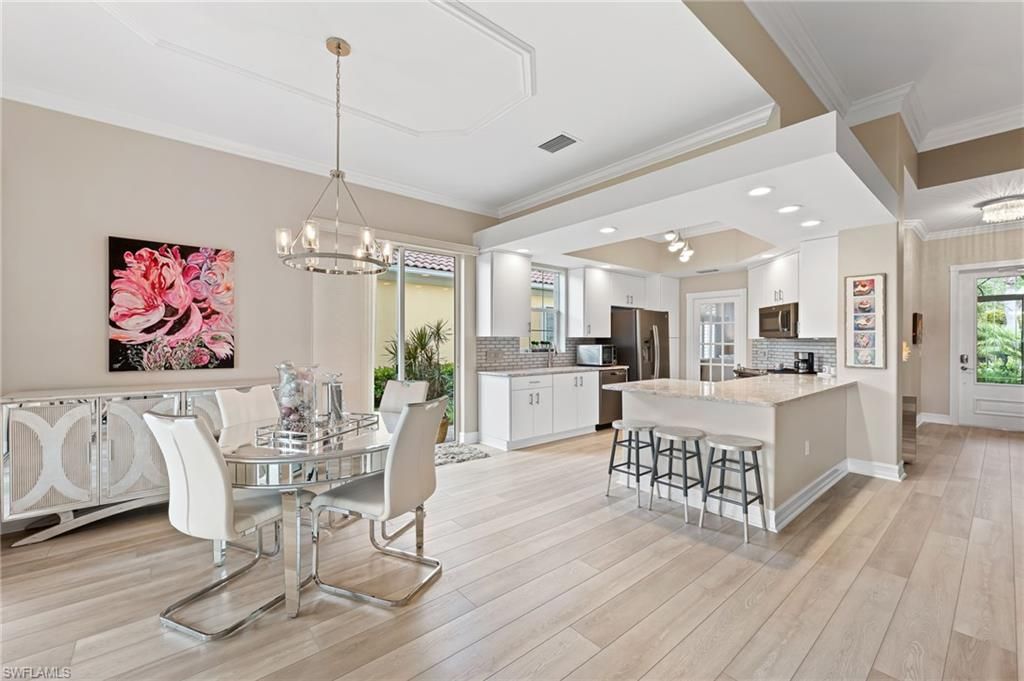 Chandelier, Dining room, Interior, Kitchen, Pendant Lights, Recessed Lighting, Stainless Steel Appliances, Wood Texture Flooring