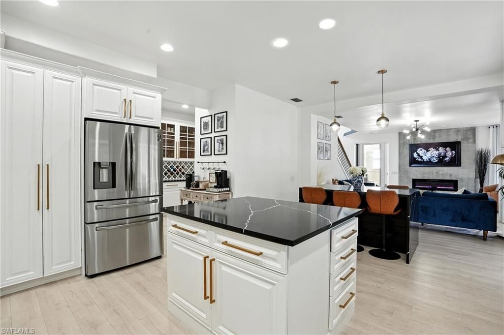 Dining room, Fireplace, Interior, Kitchen, Living room, Pendant Lights, Recessed Lighting, Stainless Steel Appliances, Wood Texture Flooring