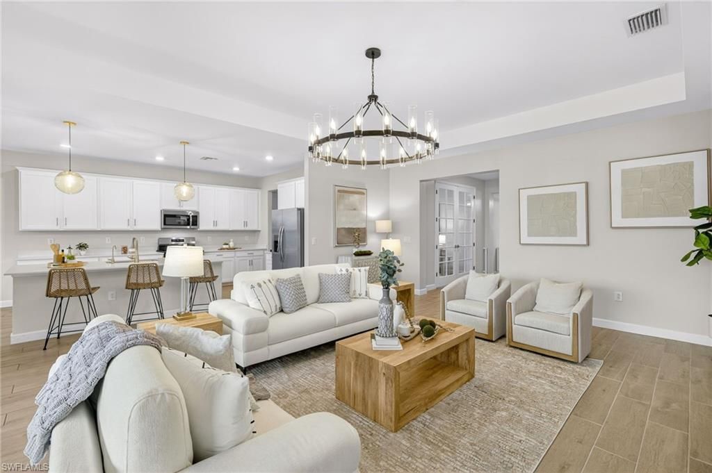 Chandelier, Interior, Kitchen, Living room, Pendant Lights, Recessed Lighting, Stainless Steel Appliances, Wood Texture Flooring