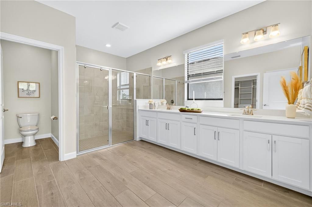 Bathroom, Dual Sink Vanities, Glass Shower, Interior, Recessed Lighting, Wood Texture Flooring