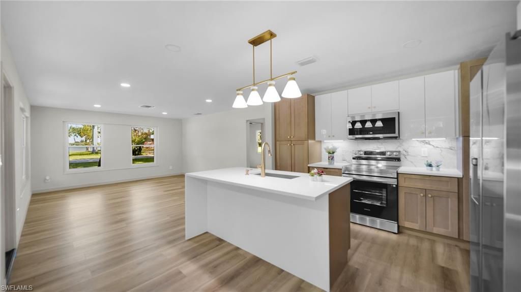 Interior, Kitchen, Pendant Lights, Recessed Lighting, Stainless Steel Appliances, Wood Texture Flooring