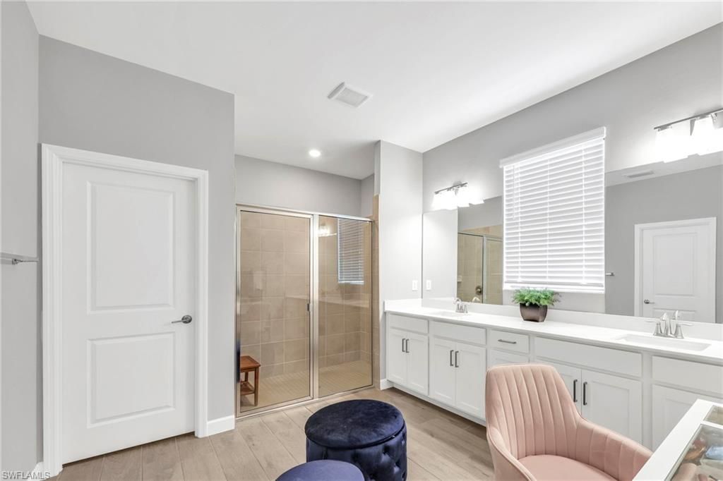 Bathroom, Dual Sink Vanities, Glass Shower, Interior, Recessed Lighting, Wood Texture Flooring