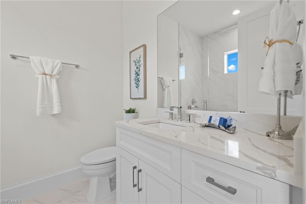 Bathroom, Dual Sink Vanities, Interior, Marble, Marble Walls, Recessed Lighting