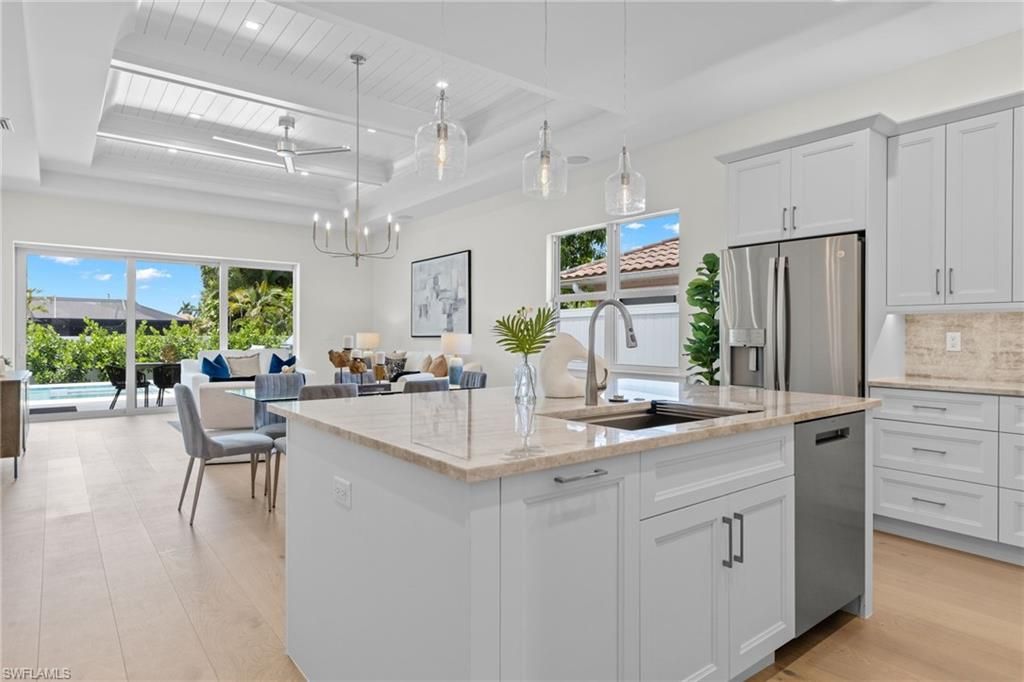 Chandelier, Dining room, Interior, Kitchen, Living room, Pendant Lights, Stainless Steel Appliances, Wood Texture Flooring