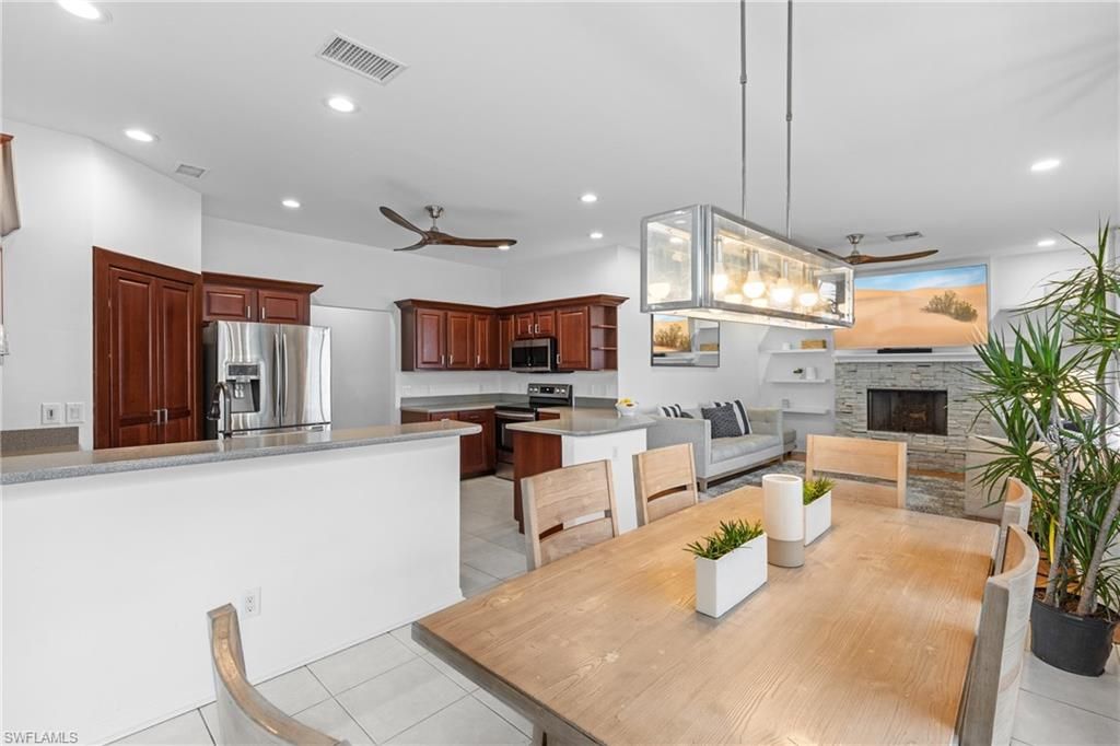 Dining room, Fireplace, Interior, Kitchen, Living room, Pendant Lights, Recessed Lighting, Stainless Steel Appliances