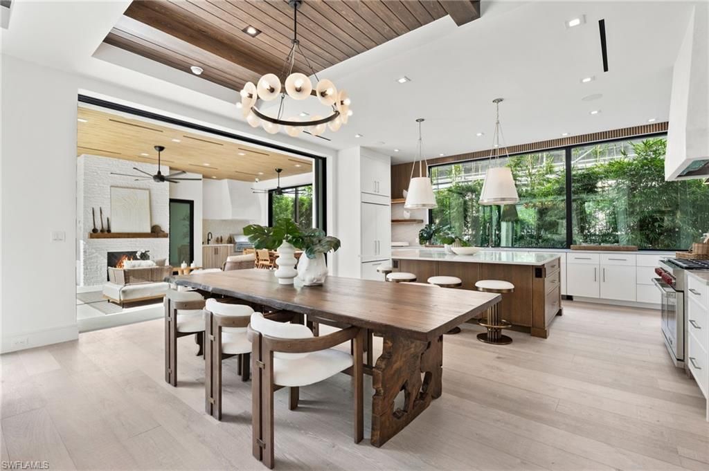 Chandelier, Dining room, Fireplace, Interior, Kitchen, Living room, Pendant Lights, Recessed Lighting, Wooden Ceilings, Wood Texture Flooring