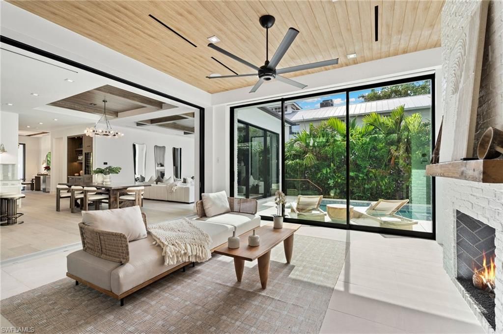 Chandelier, Dining room, Fireplace, Interior, Living room, Pendant Lights, Recessed Lighting, Wooden Ceilings