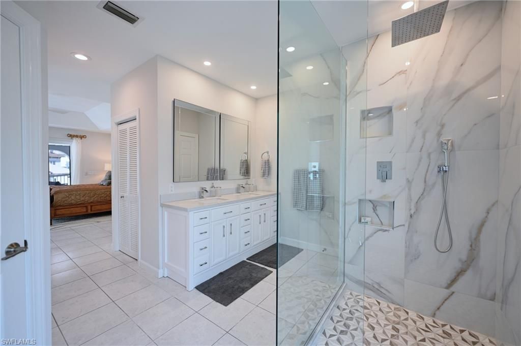 Bathroom, Dual Sink Vanities, Glass Shower, Interior, Marble Walls, Recessed Lighting