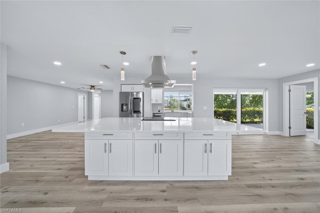 Interior, Kitchen, Pendant Lights, Recessed Lighting, Stainless Steel Appliances, Wood Texture Flooring