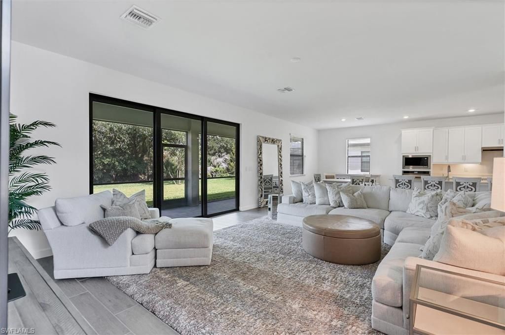 Dining room, Interior, Kitchen, Living room, Recessed Lighting, Stainless Steel Appliances, Wood Texture Flooring