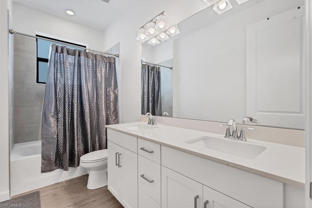 Bathroom, Dual Sink Vanities, Interior, Recessed Lighting, Wood Texture Flooring