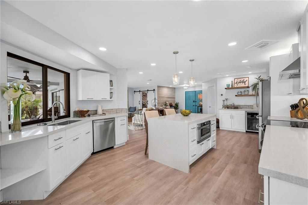 Dining room, Interior, Kitchen, Pendant Lights, Recessed Lighting, Stainless Steel Appliances, Wood Texture Flooring