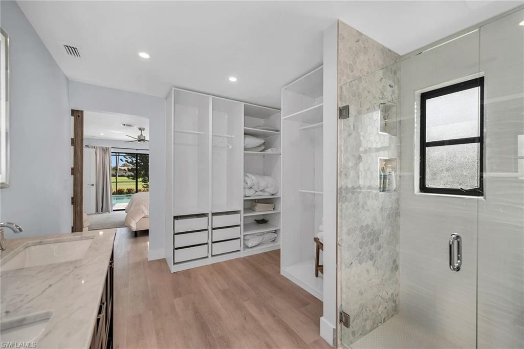 Bathroom, Interior, Marble Walls, Recessed Lighting, Walk-in Closets, Wood Texture Flooring