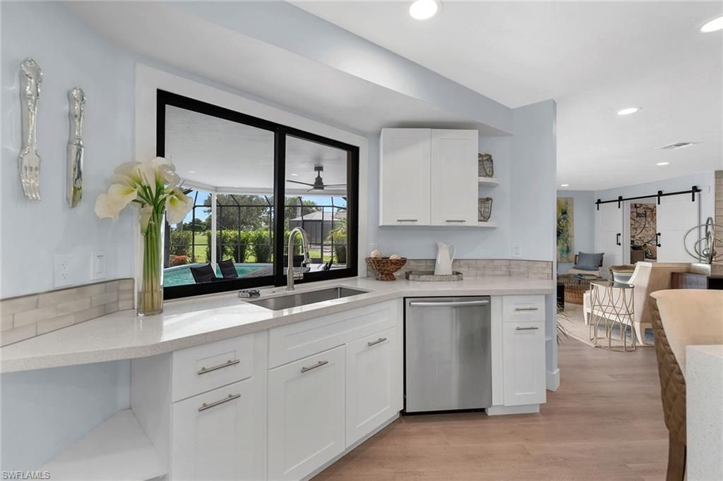 Dining room, Interior, Kitchen, Recessed Lighting, Stainless Steel Appliances, Wood Texture Flooring