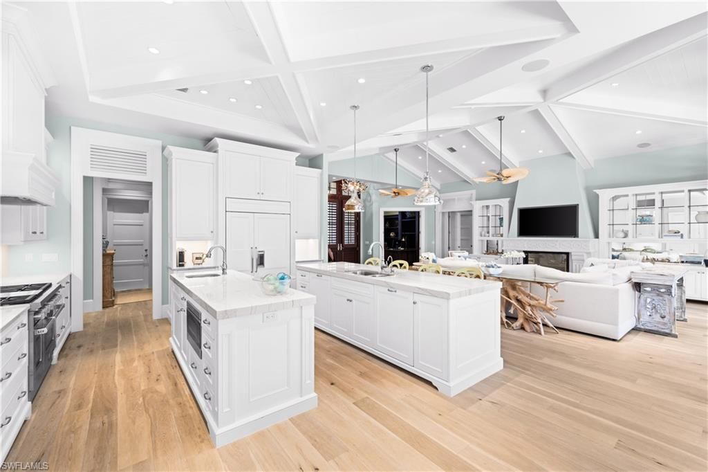 Fireplace, Interior, Kitchen, Living room, Pendant Lights, Recessed Lighting, Stainless Steel Appliances, Wood Texture Flooring