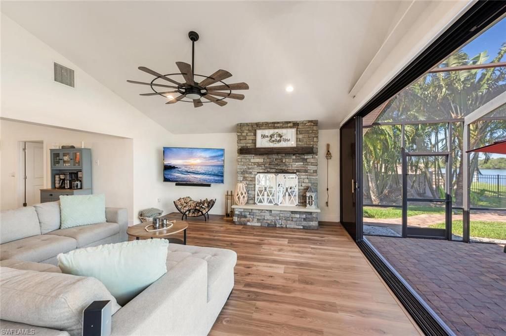 Fireplace, Interior, Living room, Recessed Lighting, Stone Walls, Wood Texture Flooring