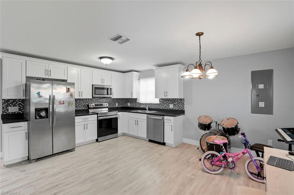 Chandelier, Interior, Kitchen, Stainless Steel Appliances, Wood Texture Flooring