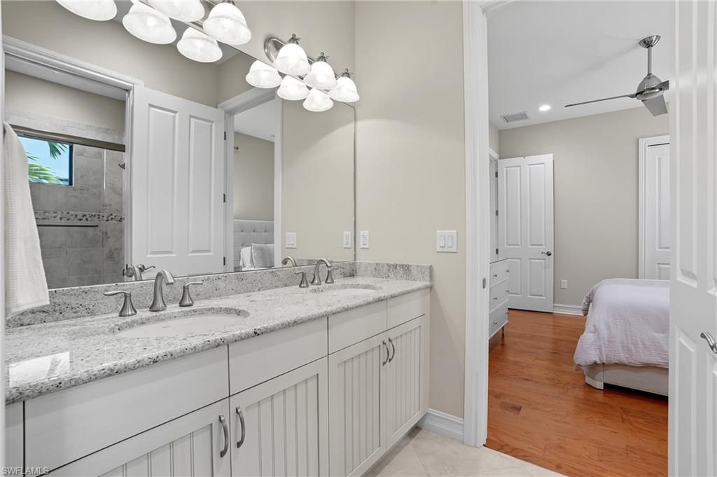 Bathroom, Dual Sink Vanities, Interior, Recessed Lighting, Wood Texture Flooring