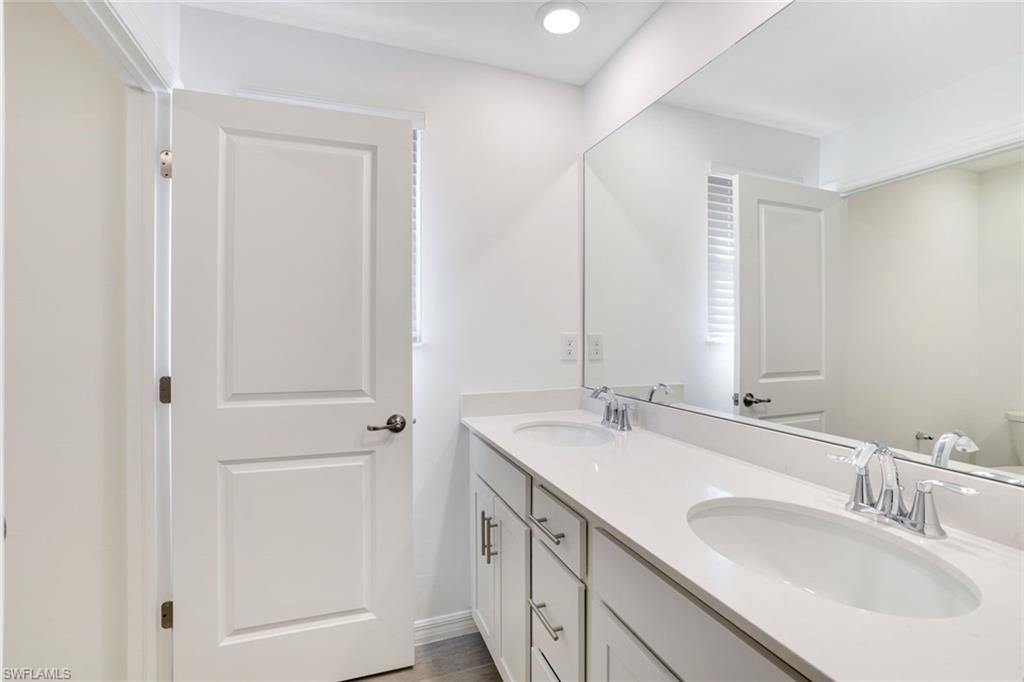Bathroom, Dual Sink Vanities, Interior, Recessed Lighting, Wood Texture Flooring