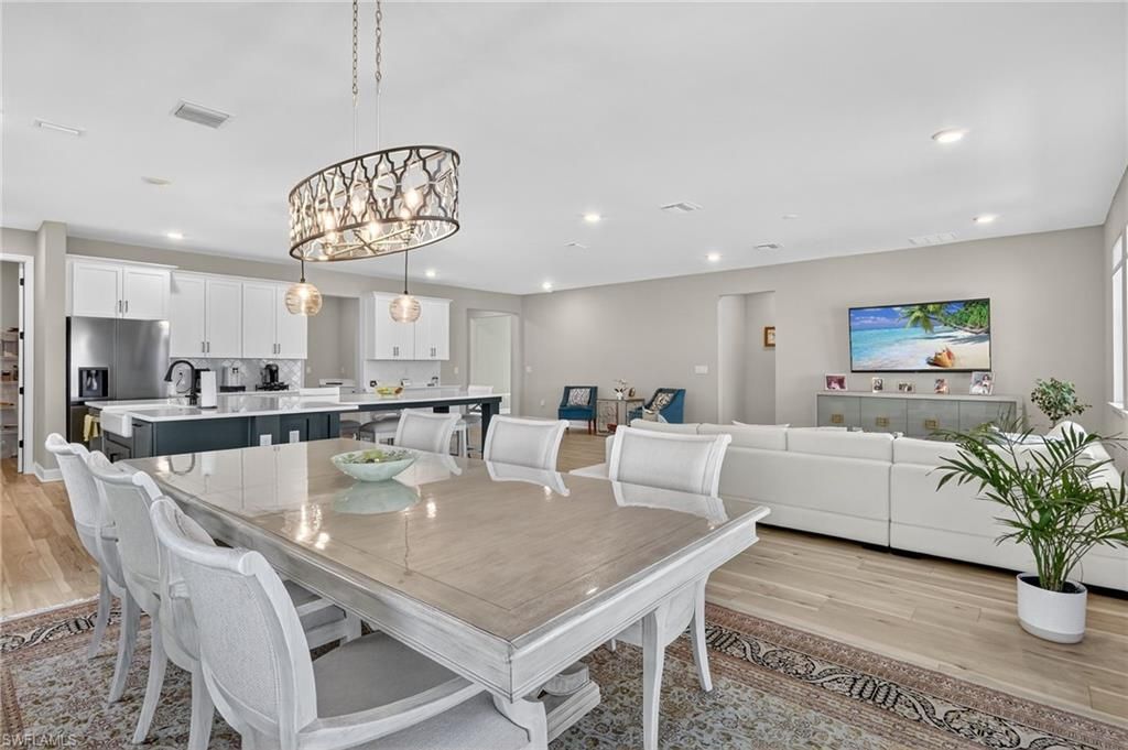 Dining room, Interior, Kitchen, Living room, Pendant Lights, Recessed Lighting, Stainless Steel Appliances, Wood Texture Flooring