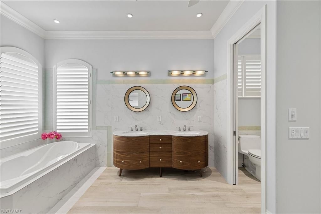 Bathroom, Dual Sink Vanities, Interior, Marble Walls, Recessed Lighting, Wood Texture Flooring