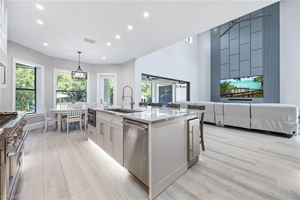 Dining room, Interior, Kitchen, Living room, Pendant Lights, Recessed Lighting, Stainless Steel Appliances, Wood Texture Flooring