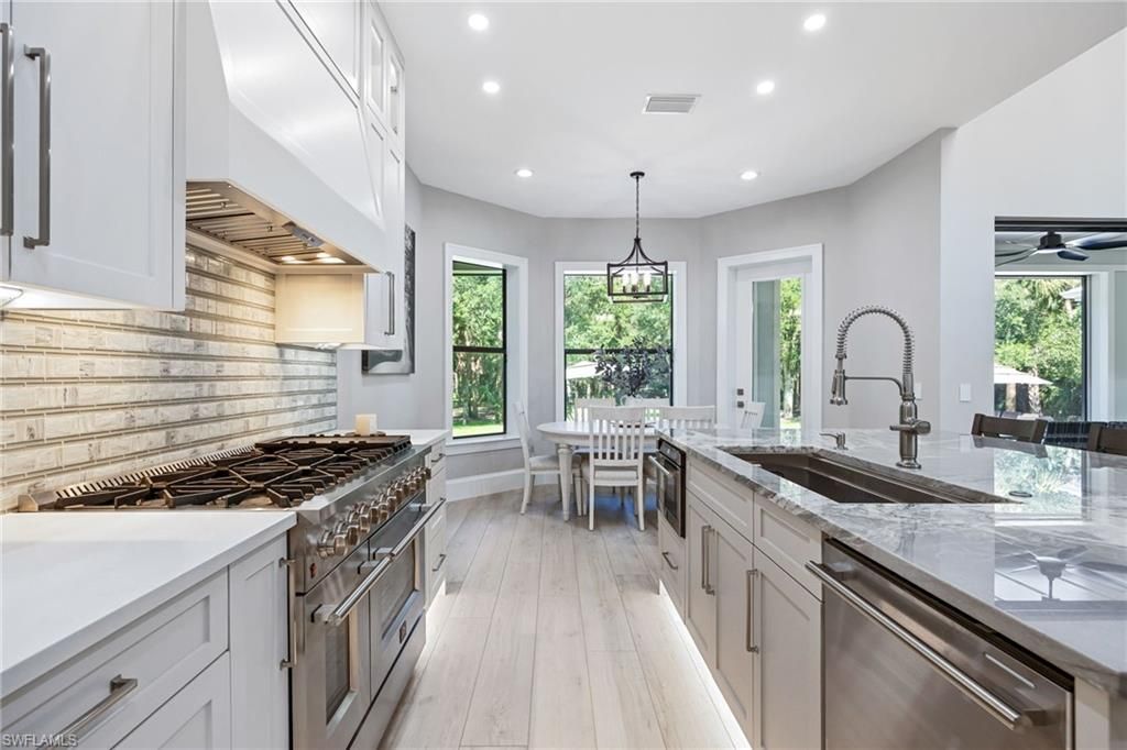 Dining room, Interior, Kitchen, Pendant Lights, Recessed Lighting, Stainless Steel Appliances, Wood Texture Flooring