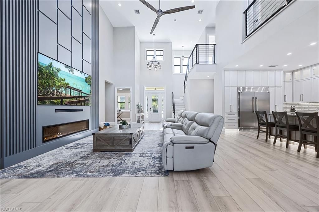 Fireplace, Interior, Kitchen, Living room, Pendant Lights, Recessed Lighting, Stainless Steel Appliances, Wood Texture Flooring