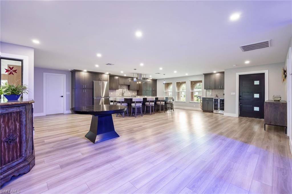 Dining room, Interior, Kitchen, Pendant Lights, Recessed Lighting, Stainless Steel Appliances, Wood Texture Flooring