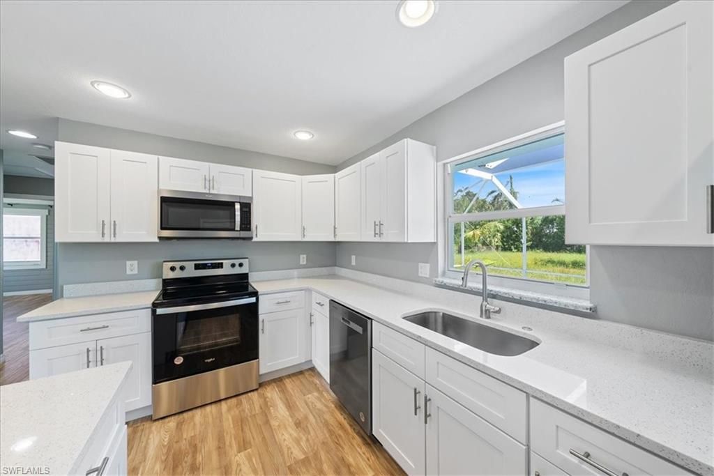 Interior, Kitchen, Recessed Lighting, Stainless Steel Appliances, Wood Texture Flooring