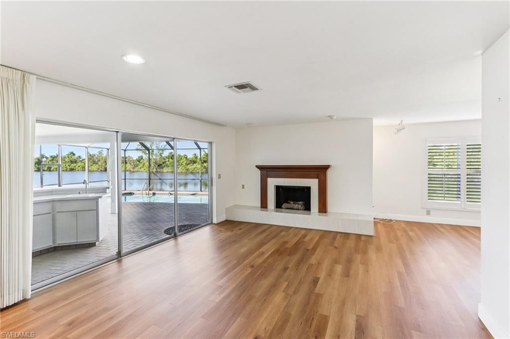 Empty room, Fireplace, Interior, Recessed Lighting, Water, Wood Texture Flooring