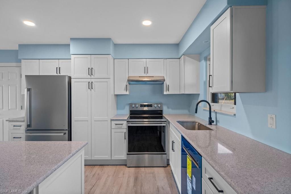 Interior, Kitchen, Recessed Lighting, Stainless Steel Appliances, Wood Texture Flooring