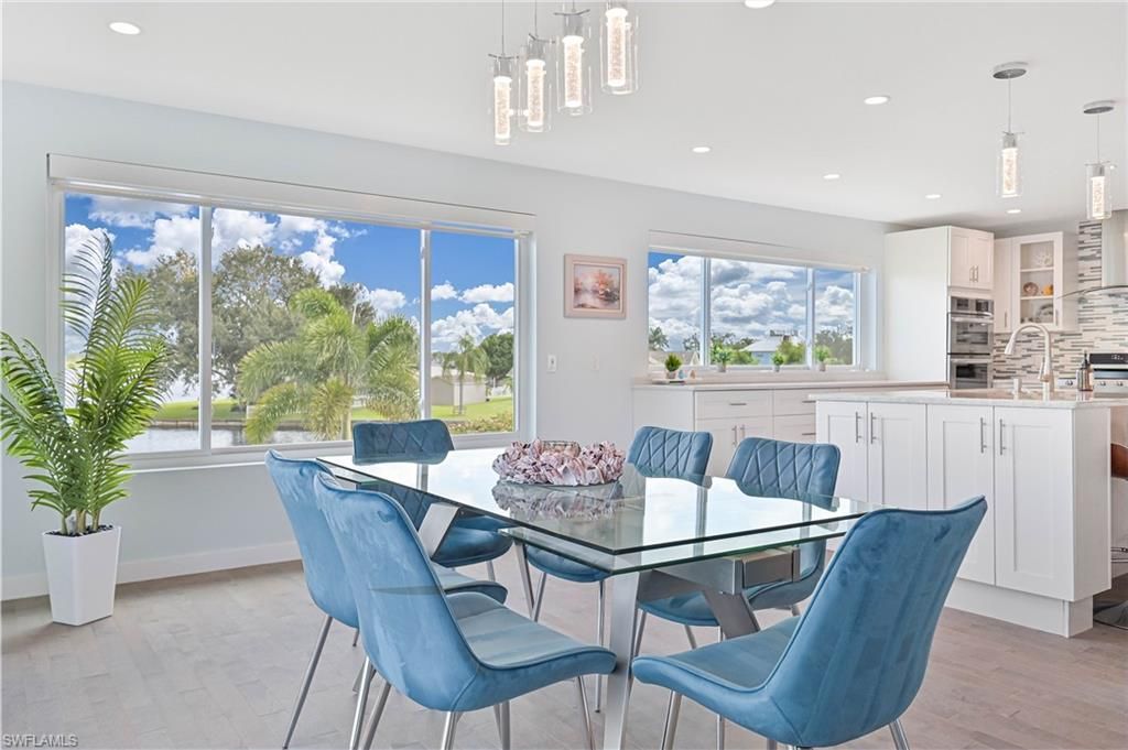 Dining room, Interior, Kitchen, Pendant Lights, Recessed Lighting, Stainless Steel Appliances, Wood Texture Flooring