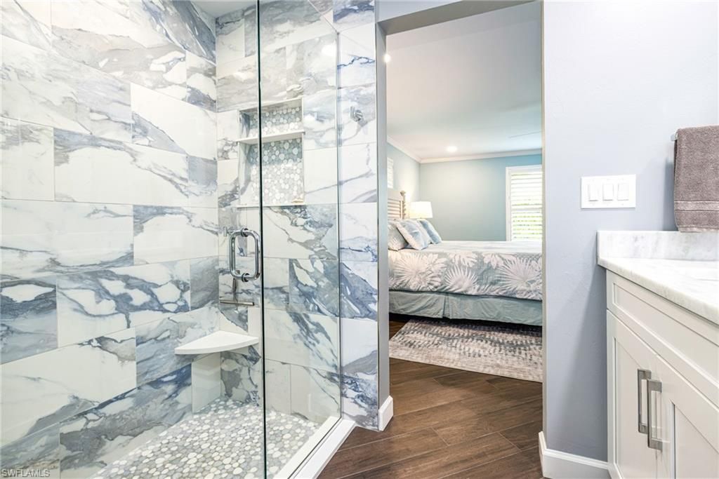 Bathroom, Bedroom, Glass Shower, Interior, Marble Walls, Recessed Lighting, Wood Texture Flooring