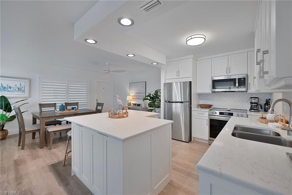 Dining room, Interior, Kitchen, Recessed Lighting, Stainless Steel Appliances, Wood Texture Flooring