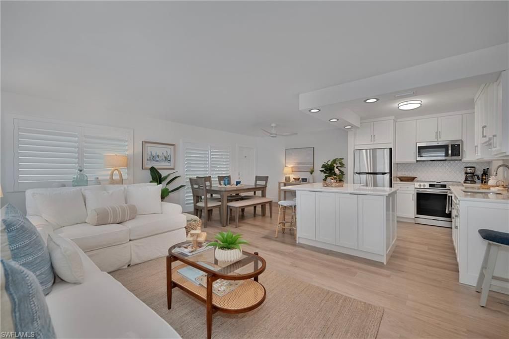 Dining room, Interior, Kitchen, Living room, Recessed Lighting, Stainless Steel Appliances, Wood Texture Flooring