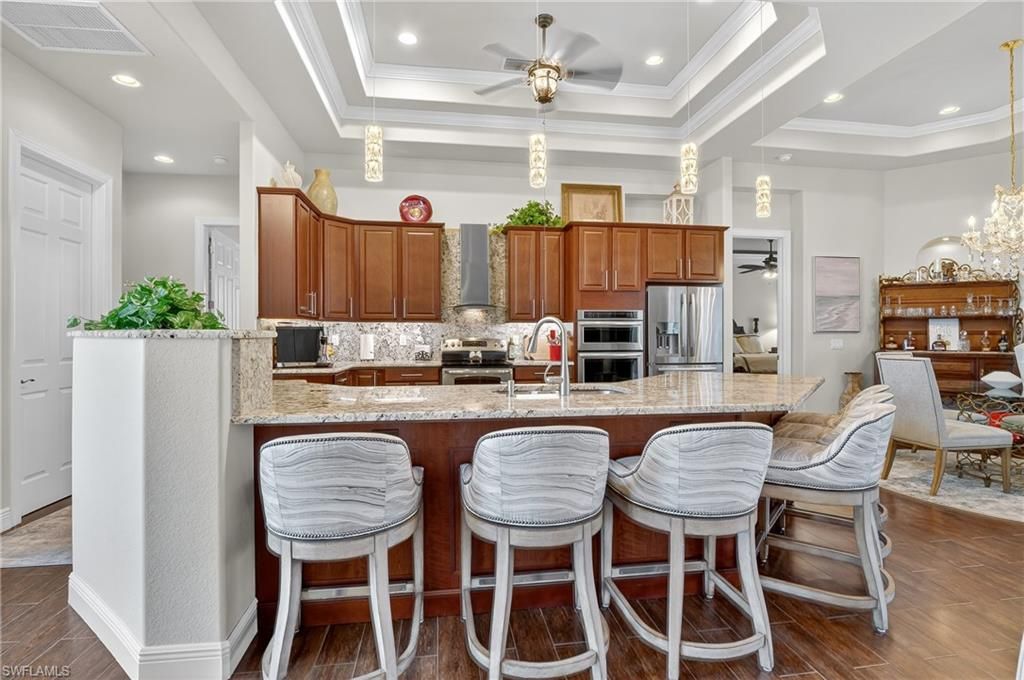 Chandelier, Dining room, Interior, Kitchen, Pendant Lights, Recessed Lighting, Stainless Steel Appliances, Wood Texture Flooring