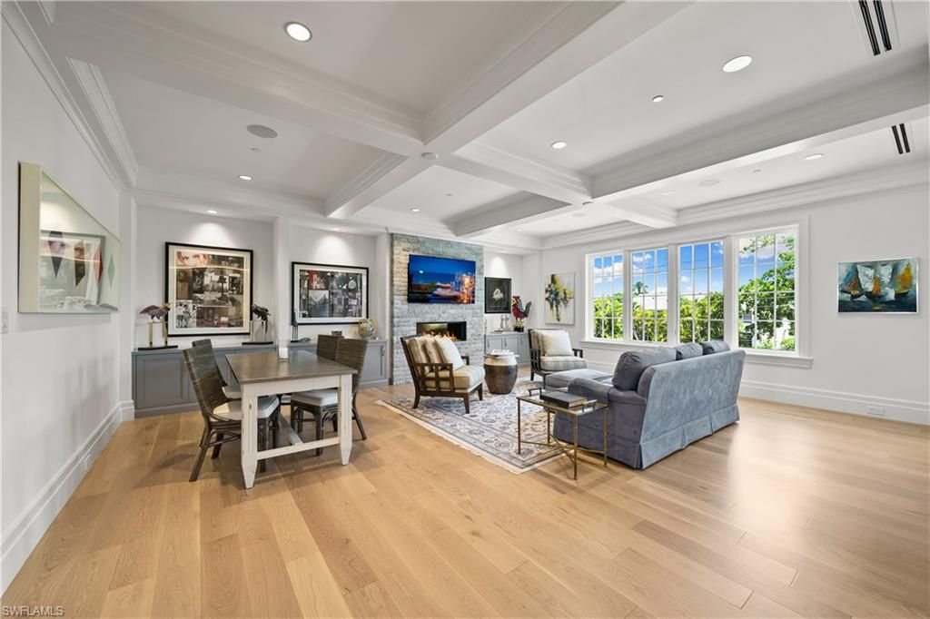 Dining room, Fireplace, Interior, Living room, Recessed Lighting, Stone Walls, Wood Texture Flooring