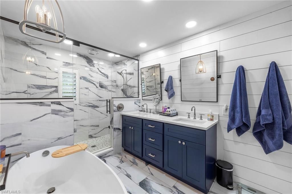 Bathroom, Dual Sink Vanities, Glass Shower, Interior, Marble, Marble Walls, Recessed Lighting