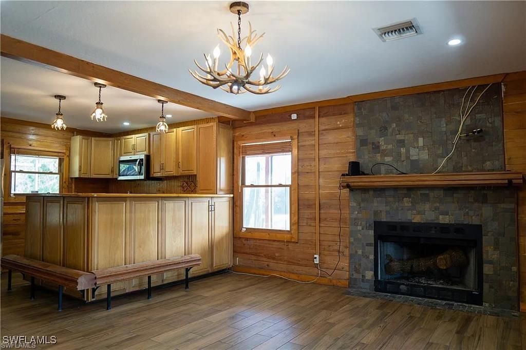 Chandelier, Fireplace, Interior, Recessed Lighting, Wood Texture Flooring, Wooden Walls