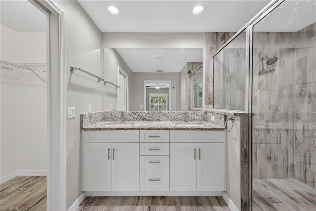 Bathroom, Glass Shower, Interior, Recessed Lighting, Walk-in Closets, Wood Texture Flooring
